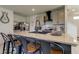 Kitchen with breakfast bar, sleek appliances, and contemporary finishes at 34110 Jasper Stone Dr, Wesley Chapel, FL 33543