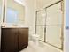 Modern bathroom with a glass-enclosed shower, toilet, and vanity at 3444 Acacia Bay Ave, Wesley Chapel, FL 33543