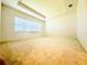A spacious bedroom featuring a tray ceiling and ample natural light at 3444 Acacia Bay Ave, Wesley Chapel, FL 33543