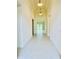 Bright hallway featuring tile flooring, recessed lighting, and an open view of the home's layout at 3444 Acacia Bay Ave, Wesley Chapel, FL 33543