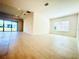 Open living room with tile flooring, recessed lighting, and sliding glass doors at 3444 Acacia Bay Ave, Wesley Chapel, FL 33543