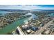 Beautiful aerial view of the waterfront property and bridge showcasing scenic beauty of the coast at 3805 Gulf Blvd # 404, St Pete Beach, FL 33706