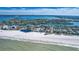 Breathtaking aerial view of the coastal property, showcasing its prime beach front location and surroundings at 3805 Gulf Blvd # 404, St Pete Beach, FL 33706