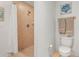 Bathroom includes a tiled walk-in shower and neutral toned wall decor at 3805 Gulf Blvd # 404, St Pete Beach, FL 33706