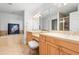 Bright bathroom showcases double sinks, a vanity area, a standalone tub, and a glass-enclosed shower at 3805 Gulf Blvd # 404, St Pete Beach, FL 33706
