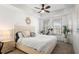 Bright bedroom featuring a large window, ceiling fan, and neutral decor at 3805 Gulf Blvd # 404, St Pete Beach, FL 33706