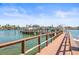 Waterfront property featuring a private boat dock with deep water access for boating and water activities at 3805 Gulf Blvd # 404, St Pete Beach, FL 33706