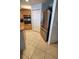 Kitchen area featuring tile floor, stainless steel refrigerator and wall oven at 3805 Gulf Blvd # 404, St Pete Beach, FL 33706