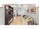 Welcoming condo living room featuring tiled floor, comfortable seating, and hallway at 3805 Gulf Blvd # 404, St Pete Beach, FL 33706
