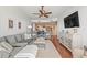 Spacious living room showing the open floor plan, adjacent dining room, and access to the balcony at 3805 Gulf Blvd # 404, St Pete Beach, FL 33706