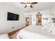 Relaxing main bedroom with a large TV and access to other rooms at 3805 Gulf Blvd # 404, St Pete Beach, FL 33706