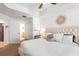 Bright main bedroom with ensuite bathroom, walk-in closet, and a plush bed at 3805 Gulf Blvd # 404, St Pete Beach, FL 33706