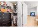 Walk-in closet with built-in shelving and drawers, adjoining a Primary bathroom with a soaking tub at 3805 Gulf Blvd # 404, St Pete Beach, FL 33706