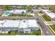 This angle shows the community featuring a pool, shuffleboard, assigned parking and mature landscaping at 504 Cara Ct # 504, Largo, FL 33771