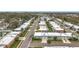 This aerial angle highlights single-story homes, mature landscaping and an established neighborhood at 504 Cara Ct # 504, Largo, FL 33771