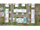Aerial view of a residential neighborhood featuring single-story homes, well-maintained landscaping, and a community pool at 504 Cara Ct # 504, Largo, FL 33771