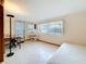 Inviting bedroom/study space with natural light, tile flooring, and a flexible layout for work or relaxation at 504 Cara Ct # 504, Largo, FL 33771