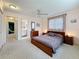 Spacious bedroom with a ceiling fan, closet, and an ensuite bathroom at 504 Cara Ct # 504, Largo, FL 33771