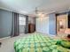 Large bedroom features gray walls, carpet, ceiling fan, closet, and natural light at 504 Cara Ct # 504, Largo, FL 33771