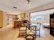 Open concept dining area with views of kitchen and a separate living space at 504 Cara Ct # 504, Largo, FL 33771