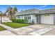 Well-maintained single story home featuring a clean driveway and a tidy, green front yard at 504 Cara Ct # 504, Largo, FL 33771