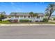 Charming single-story home with lush landscaping and a well-maintained gray roof at 504 Cara Ct # 504, Largo, FL 33771