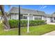 Corner lot featuring a cozy home with tidy landscaping and a street marker indicating the address at 504 Cara Ct # 504, Largo, FL 33771