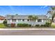 Charming single-story home with lush landscaping and a well-maintained gray roof at 504 Cara Ct # 504, Largo, FL 33771
