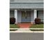 Community clubhouse featuring well-maintained doors and entryway with lush landscaping at 504 Cara Ct # 504, Largo, FL 33771