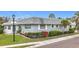 Charming single-story home with mature landscaping, including red shrubbery at 504 Cara Ct # 504, Largo, FL 33771
