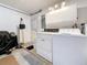 Functional laundry area with appliances, ample storage, and access to the exterior at 504 Cara Ct # 504, Largo, FL 33771