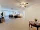Bright living room with neutral carpet, ceiling fan, and comfortable seating arrangement at 504 Cara Ct # 504, Largo, FL 33771