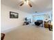 Spacious living room with neutral carpet, ample natural light, and a view towards the entry at 504 Cara Ct # 504, Largo, FL 33771