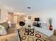 Large living area with neutral carpet, providing a clean and versatile space for living at 504 Cara Ct # 504, Largo, FL 33771