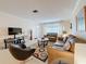 Living room featuring stylish furniture, neutral decor, and a spacious layout, perfect for gatherings at 504 Cara Ct # 504, Largo, FL 33771