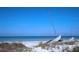 Scenic beach view with a sailboat run aground near tropical vegetation at 5267 81St N St # 18, St Petersburg, FL 33709