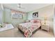 Comfortable bedroom with soft natural light, floral accents and ample closet space at 5267 81St N St # 18, St Petersburg, FL 33709
