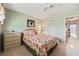 Cozy bedroom featuring floral patterns, neutral paint colors, and ample natural light at 5267 81St N St # 18, St Petersburg, FL 33709