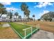 Outdoor bocce ball court with beautiful landscaping and condo buildings in background at 5267 81St N St # 18, St Petersburg, FL 33709