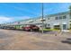 Attractive condo building with covered parking, well-kept landscaping, and complementary awnings at 5267 81St N St # 18, St Petersburg, FL 33709