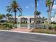 A picturesque community entrance with a charming white arbor and lush landscaping enhancing curb appeal at 5267 81St N St # 18, St Petersburg, FL 33709