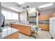 The communal kitchen features stainless steel appliances, ample counter space, and durable cabinetry at 5267 81St N St # 18, St Petersburg, FL 33709