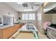 Commercial kitchen features stainless steel appliances, double sink and ample counter space at 5267 81St N St # 18, St Petersburg, FL 33709