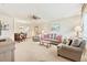 Inviting living room open to dining area, featuring comfortable seating and neutral decor at 5267 81St N St # 18, St Petersburg, FL 33709