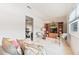 This is a cozy living room featuring comfortable seating and a wooden display cabinet at 5267 81St N St # 18, St Petersburg, FL 33709