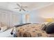 Light-filled main bedroom featuring neutral colors, ample closet space, and a comfortable bed at 5267 81St N St # 18, St Petersburg, FL 33709