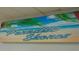 Paradise Shores sign with a beach design featuring palm trees and blue skies at 5267 81St N St # 18, St Petersburg, FL 33709