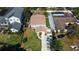 Aerial view of a home with a landscaped yard, driveway, and surrounding neighborhood at 531 Luzon Ave, Tampa, FL 33606