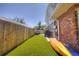 Artificial turf and fenced in backyard with room for outdoor recreation and activities at 531 Luzon Ave, Tampa, FL 33606