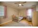 Cozy Bedroom with hardwood floors, crib, and accent chair at 531 Luzon Ave, Tampa, FL 33606